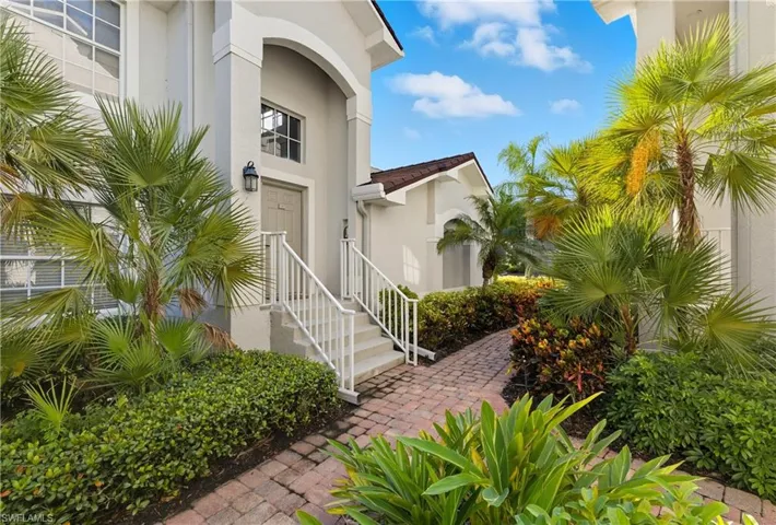 Doorway to property with stucco siding