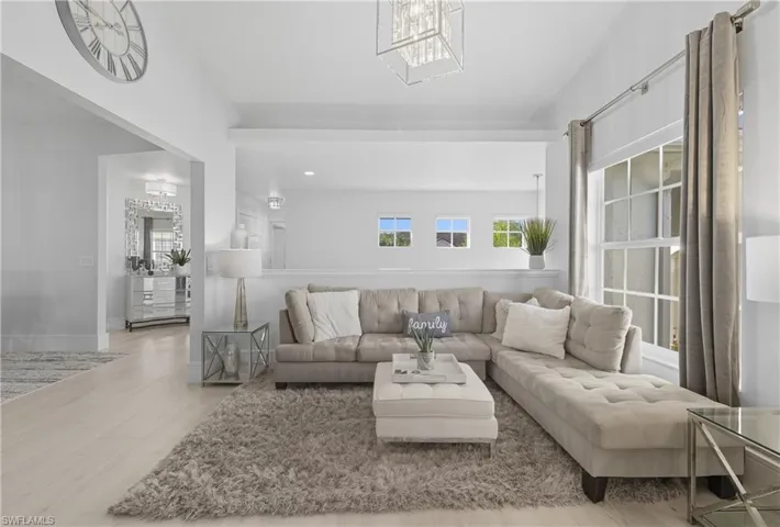 Living room with a chandelier and wood finished floors