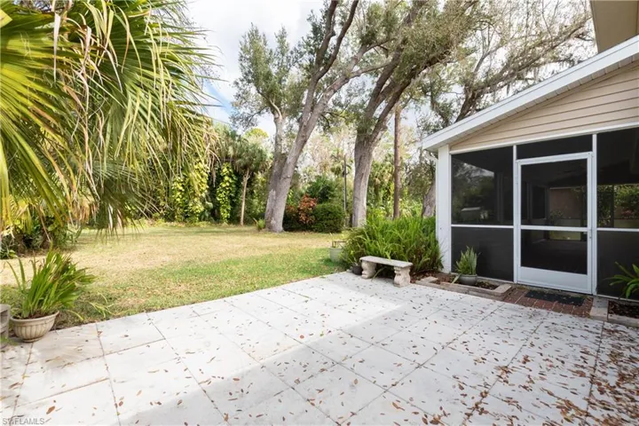 View of patio featuring and sunroom