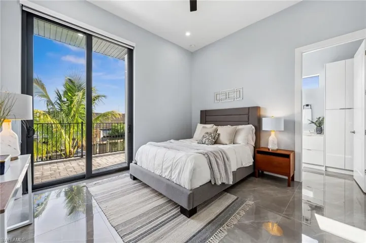 Bedroom 2  ( Junior Suite ) with full bathroom, walk-in closet and patio access.