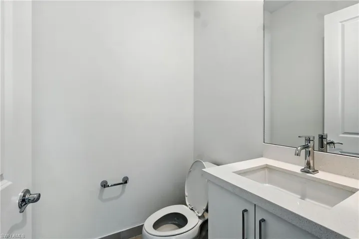 BATH #3 featuring vanity and toilet