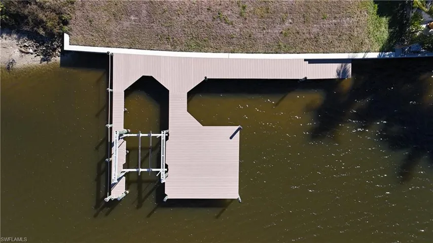 Composite dock, 10,000 lb lift and boat slip for larger boat.
