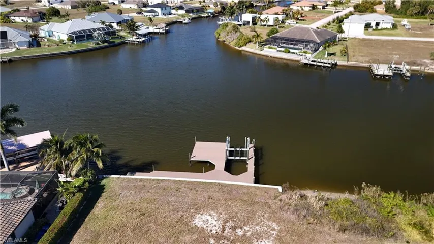 Aerial perspective of suburban area with a large body of water