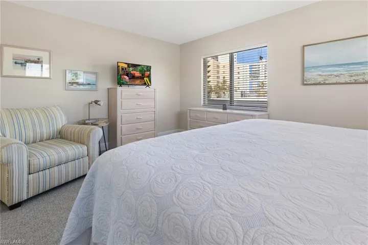 Bedroom with light carpet