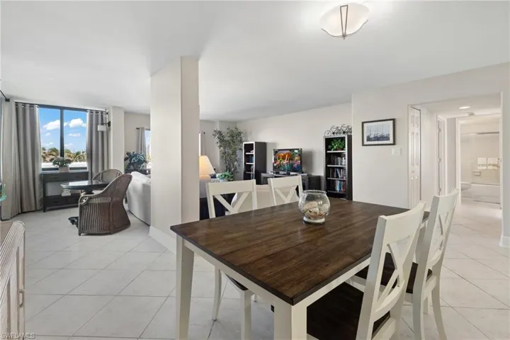 Dining room with light tile patterned floors