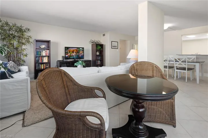 Living room with light tile patterned floors