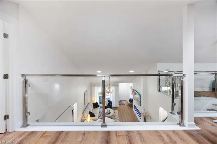 Stairs featuring hardwood / wood-style floors