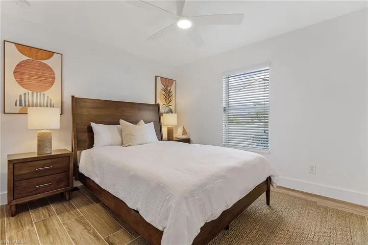 Bedroom with wood finish floors and ceiling fan