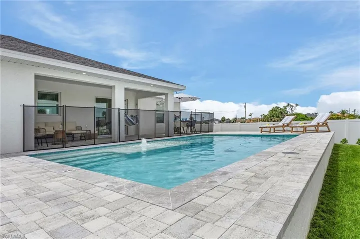 View of swimming pool with patio surround
