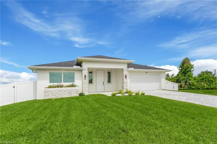 Prairie-style home featuring an attached garage, stucco siding, decorative driveway, a shingled roof, and a gate