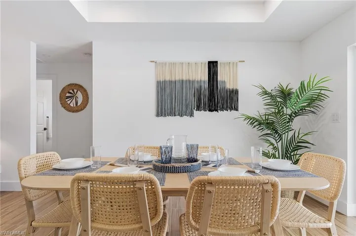 Dining area featuring light wood finished floors and baseboards