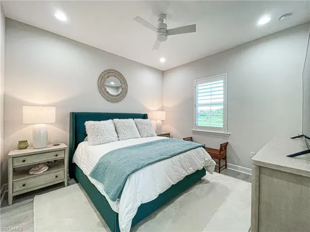 Bedroom with light wood-type flooring and ceiling fan