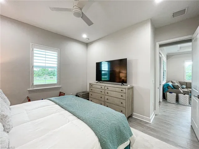 Bedroom with light wood-type flooring and ceiling fan