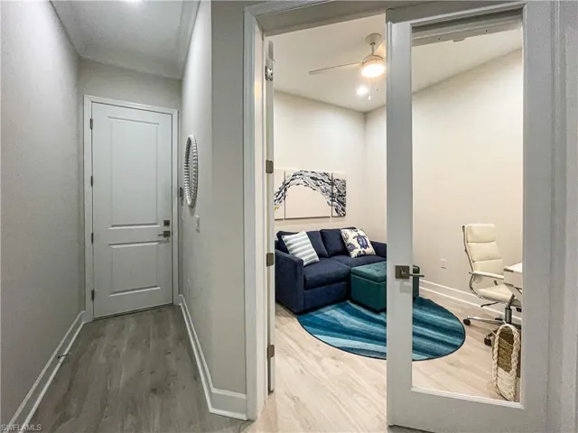 Hallway featuring hardwood / wood-style floors