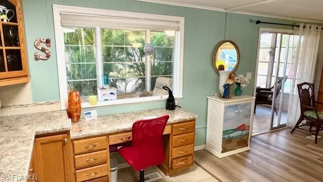 Home office built in with large picture window to let the natural light in