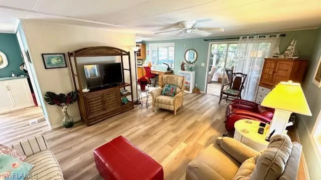 Large living area with lots of natural lighting and nicely furnished.