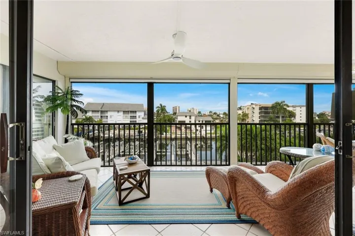 Screened lanai with ceiling fan and tile flooring