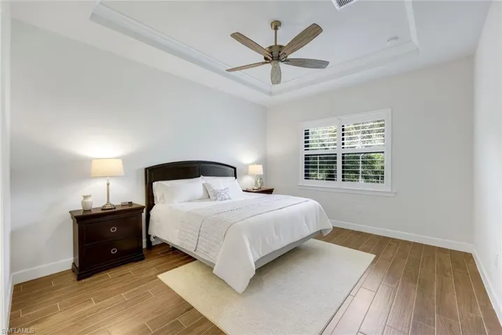 Spacious Master retreat with coffered ceiling and views of the peaceful preserve