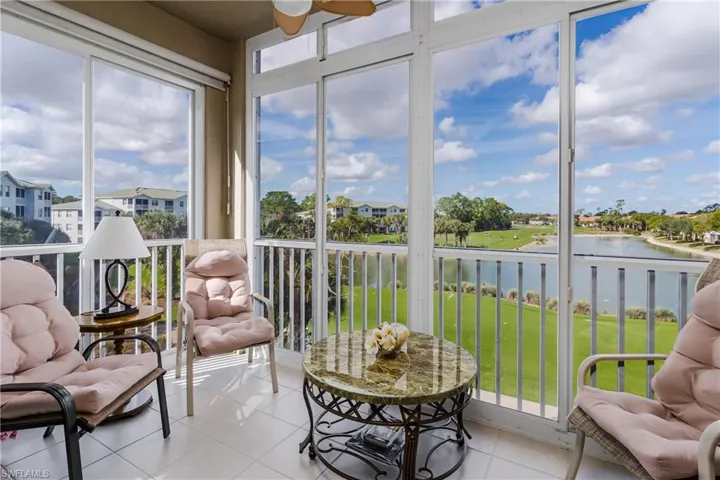 Glassed enclosed lanai with water and golf view