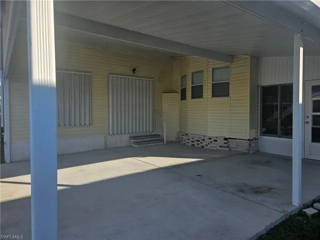 View of patio with a carport and entry steps