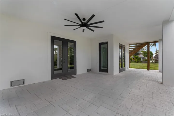 View of patio / terrace with french doors and ceiling fan