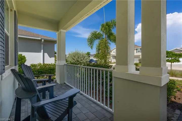 The homes cozy front porch area provides a peaceful retreat where you can unwind, read, or simply enjoy the tranquility of your surroundings