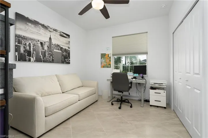 1 of 3 bedrooms currently being used as a home office.