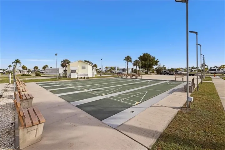 View of home's community with shuffleboard