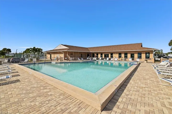 Community pool with a patio area
