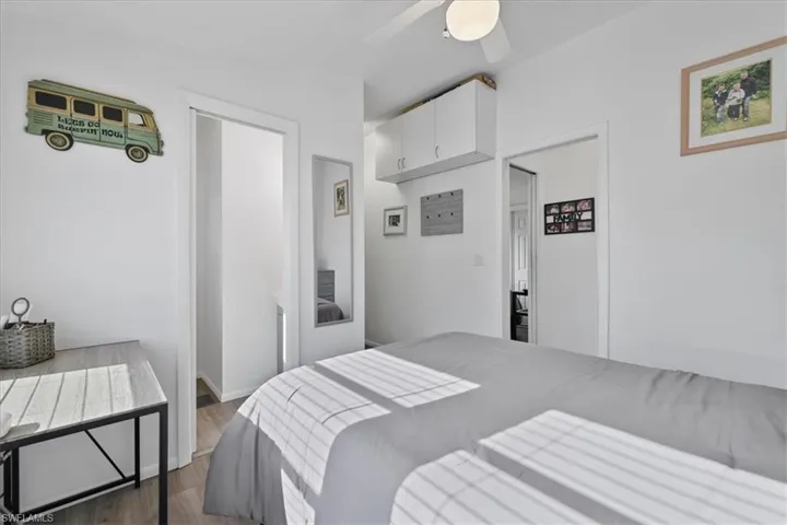 Bedroom with wood finished floors and ceiling fan