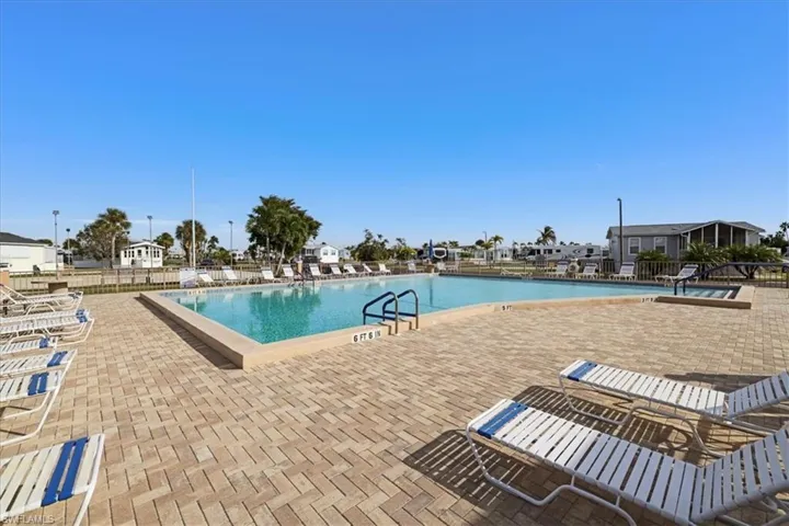 Community pool with a patio area