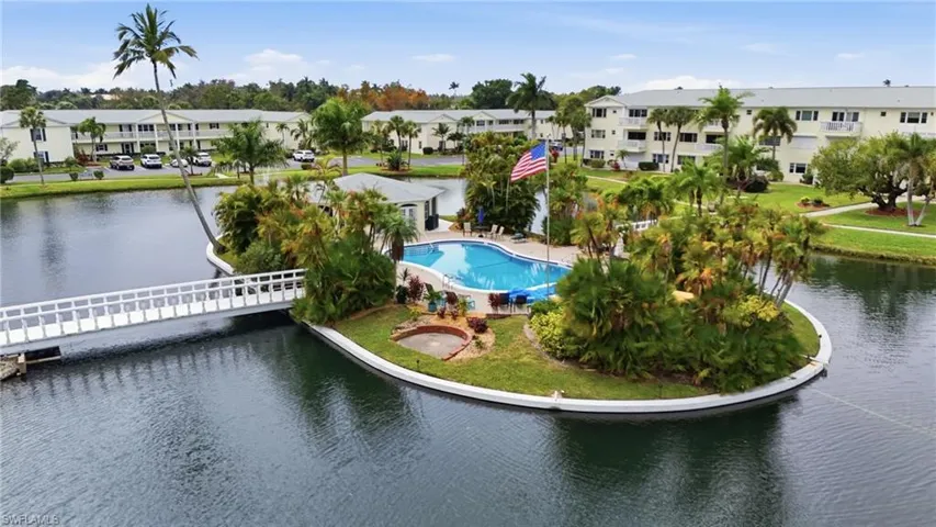 Community pool featuring a water view