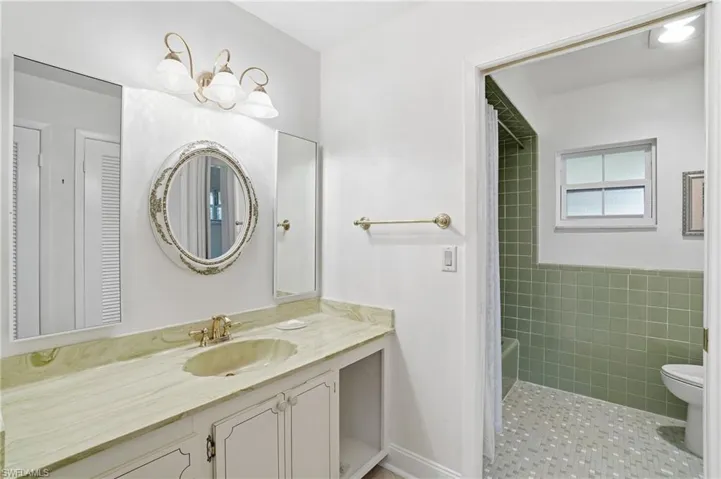 Bathroom with vanity and shower / bath combo