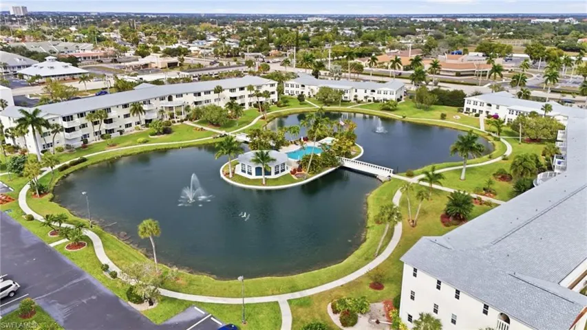 Aerial view of apartment complex / building and a nearby body of water