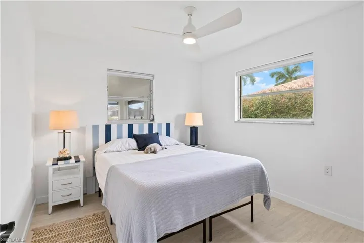 Bedroom with light wood-type flooring and ceiling fan