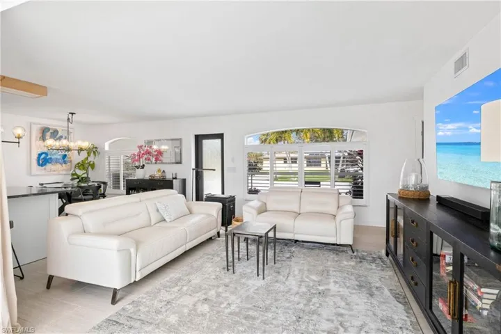 Living room featuring hanging lights