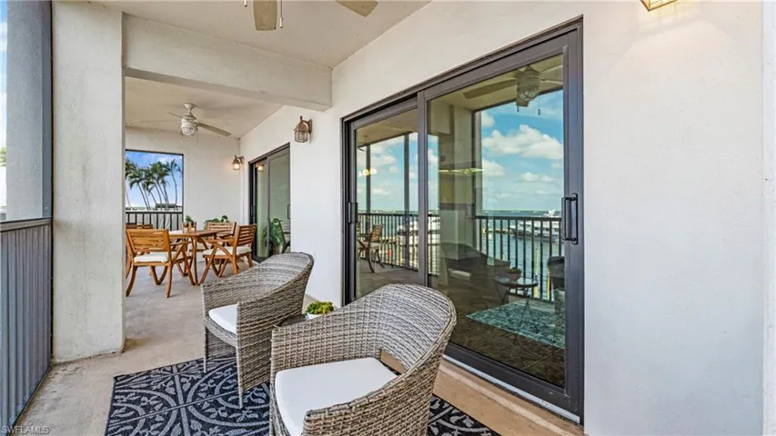 Balcony with ceiling fan and outdoor dining space