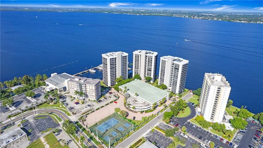 Bird's eye view of apartment complex / building and a nearby body of water
