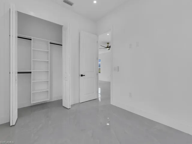 Unfurnished bedroom with a closet and recessed lighting