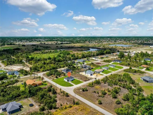 Aerial view of residential area with a large body of water