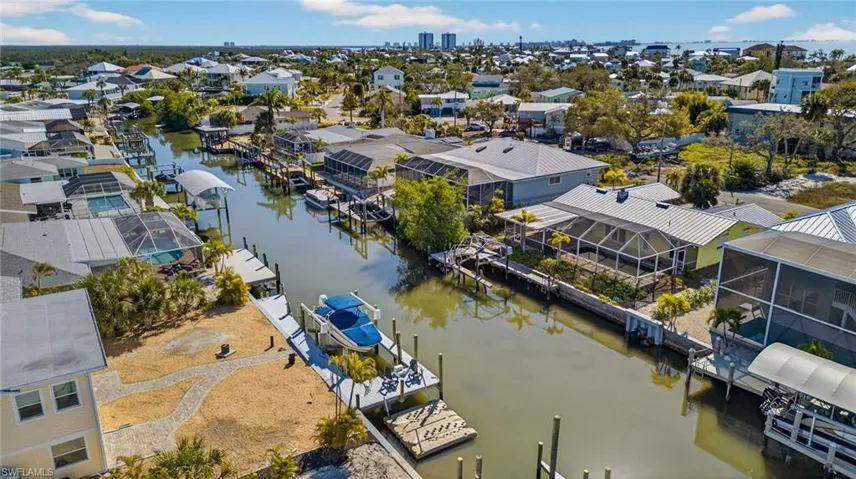 Aerial perspective of suburban area featuring a large body of water