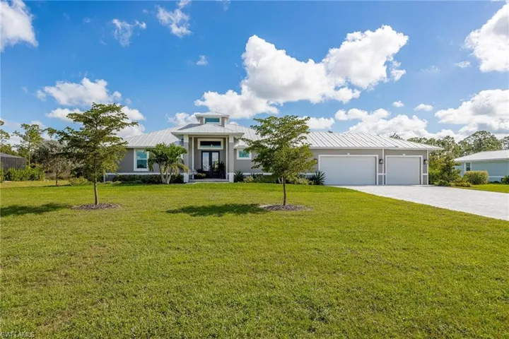 View of front of home featuring a lush front lawn