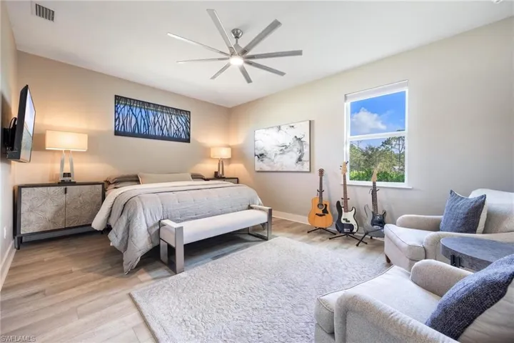 Primary Bedroom featuring transom window with amazing art piece that will convey.