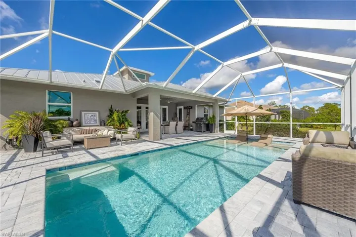 View of swimming pool featuring an outdoor living space.
