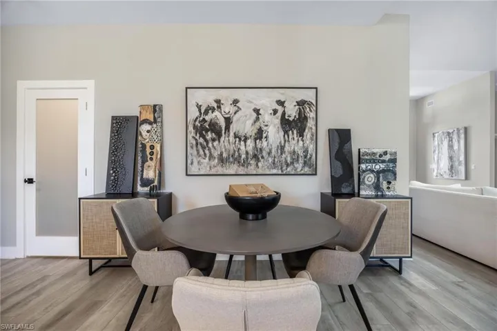 Dining area featuring light hardwood / wood-style LVP  flooring