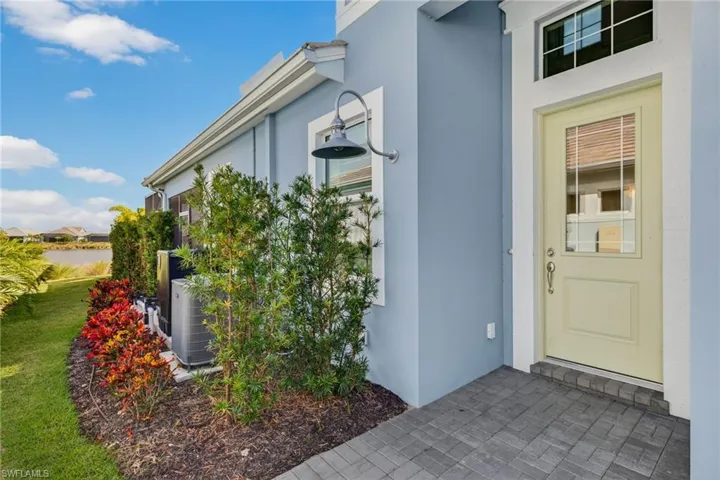 View of exterior entry featuring stucco siding