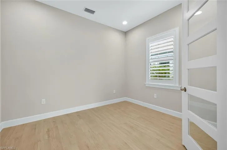 Unfurnished room featuring light wood-style flooring and recessed lighting