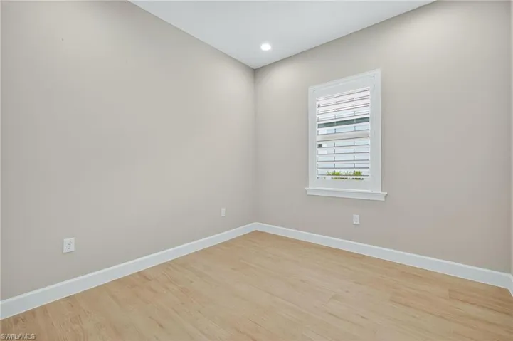 Unfurnished room featuring light wood-style floors and recessed lighting