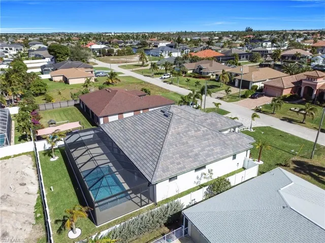 Aerial perspective of suburban area with a pool area