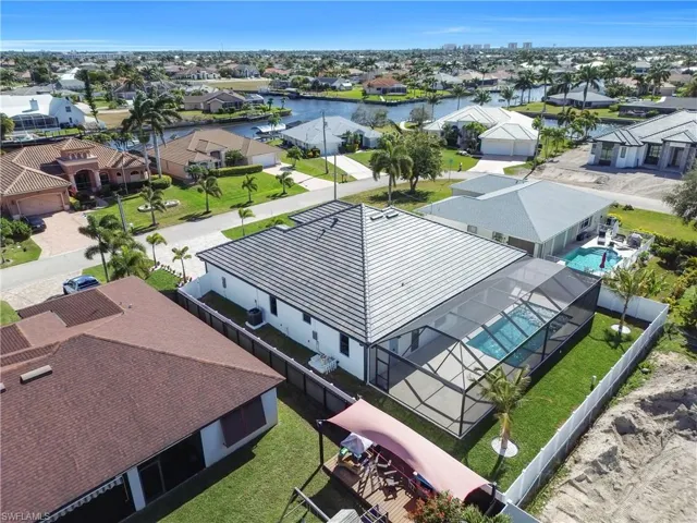 Aerial perspective of suburban area with a large body of water
